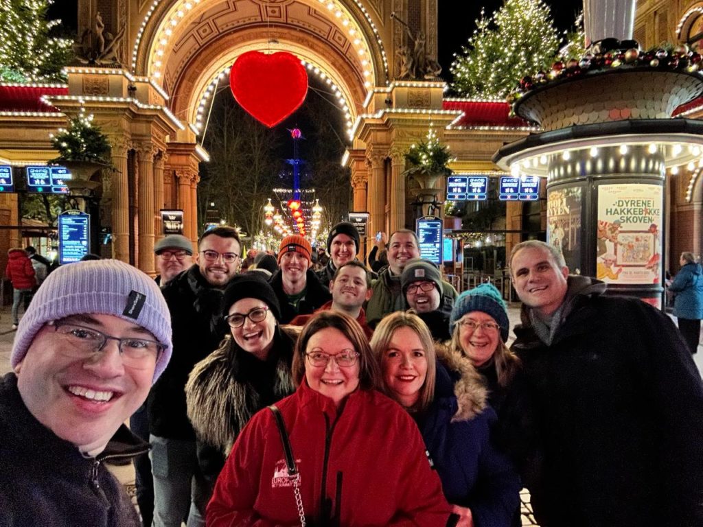 Photo showing a group of MVPs outside Tivoli Gardens, which is lit up for Christmas