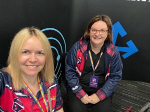 two women in a selfie, wearing Scottish Summit branded clothing