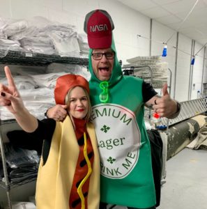 an image showing me dressed as a hot dog, next to a man dressed as a beer bottle